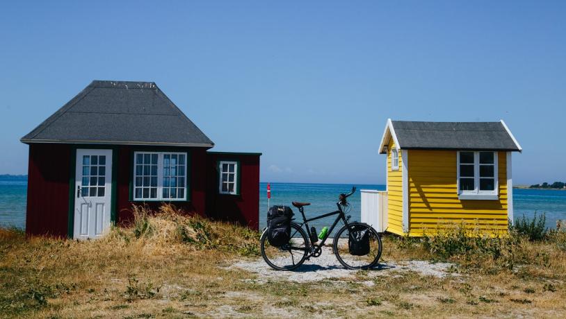 A stop by the beach cabins on Ærø while cycling the Baltic Sea Cycling Route in Denmark