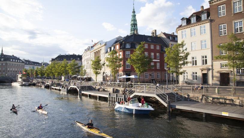 Copenhagen Canal with boats sailing and buildings 