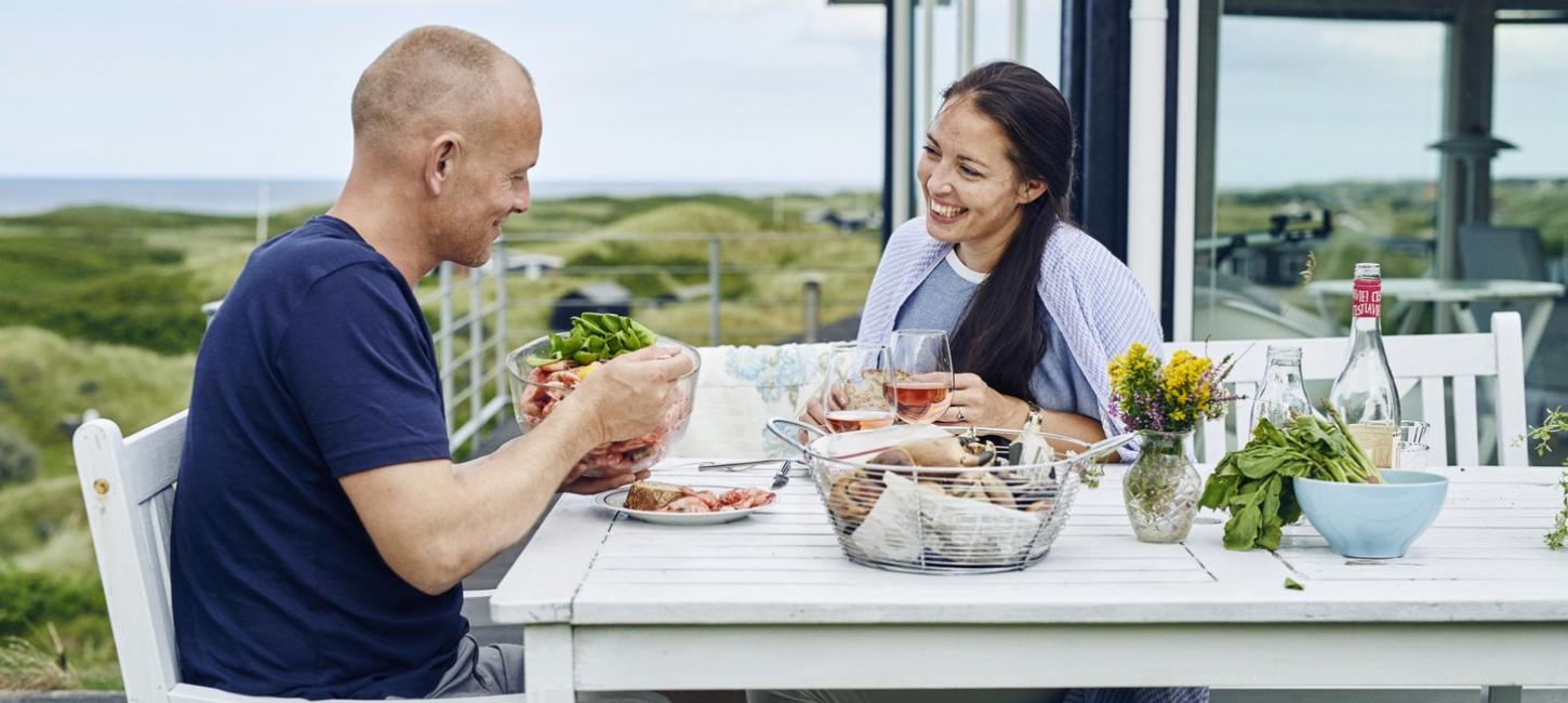 Couple eating in holiday home in North Jutland, Denmark