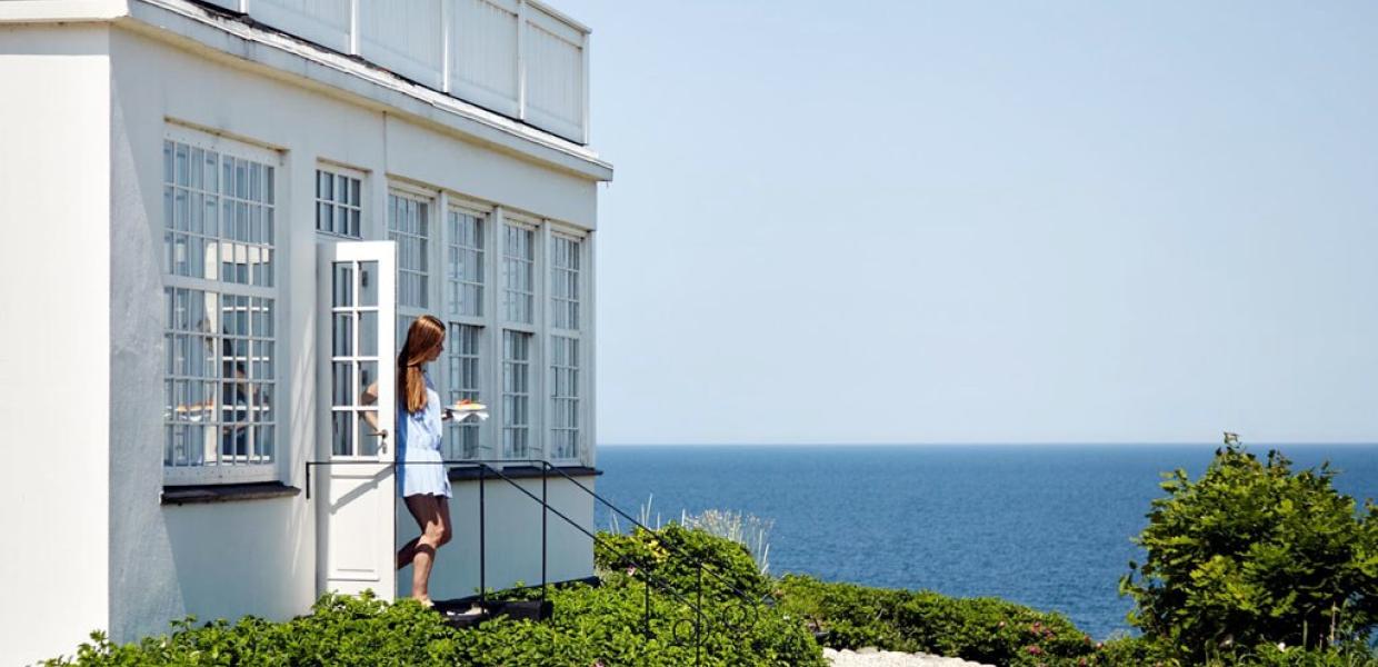 A woman walks out of Helenekilde Badehotel in North Zealand, Denmark