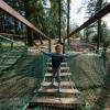 Boy playing on nature playground at Momhøje Naturcenter, Denmark