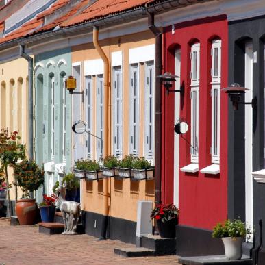 Colourful houses line a street in Fyn